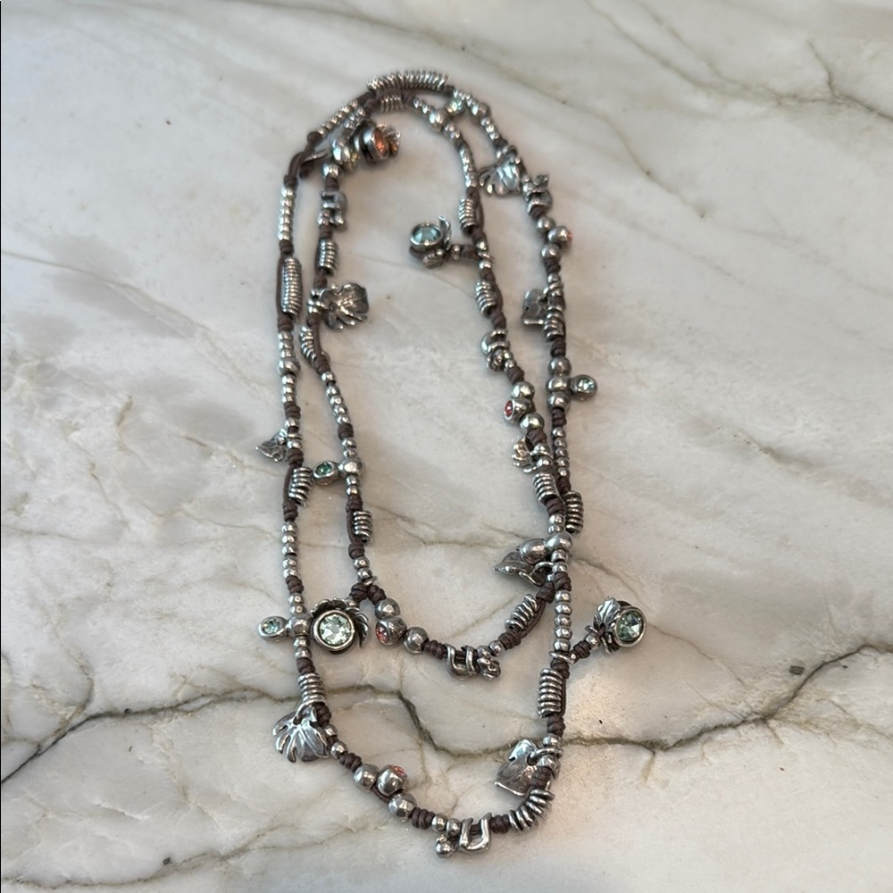 UNO de 50 Long Leather Silver Bead Necklace with Leaf and Gem Design
